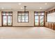 Finished basement featuring a projector, bright windows, and exterior access at 1326 White Water Ct, Cicero, IN 46034