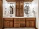 Bathroom featuring double sinks with wood cabinets and granite countertop at 1326 White Water Ct, Cicero, IN 46034