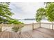 Spacious wooden deck offering panoramic views of the lake and surrounding landscape, perfect for relaxing at 1326 White Water Ct, Cicero, IN 46034