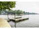 Dock with wood planking on calm lake at 1326 White Water Ct, Cicero, IN 46034