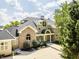Beautiful home featuring a circular window, portico, brick facade, and a well-maintained front yard at 1326 White Water Ct, Cicero, IN 46034