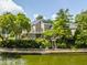Stunning waterfront property featuring a multi-level deck and landscaped yard for enjoying outdoor living at 1326 White Water Ct, Cicero, IN 46034