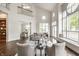 Inviting living room with a soaring ceiling, large windows with lake views, and elegant furnishings at 1326 White Water Ct, Cicero, IN 46034