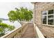 Picturesque wooden walkway on the deck, offering panoramic lake views and leading to tranquil outdoor spaces at 1326 White Water Ct, Cicero, IN 46034