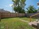 Backyard featuring grass and a wooden fence at 1327 E Minnesota St, Indianapolis, IN 46203