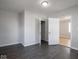 Neutral bedroom featuring dark gray flooring and a standard closet at 1327 E Minnesota St, Indianapolis, IN 46203