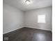 Bedroom featuring grey walls and dark vinyl flooring at 1327 E Minnesota St, Indianapolis, IN 46203
