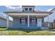 Charming single-story home featuring a cozy front porch and light blue siding, perfect for relaxed living at 1327 E Minnesota St, Indianapolis, IN 46203