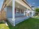 Inviting covered front porch with classic columns offers a charming space for outdoor relaxation at 1327 E Minnesota St, Indianapolis, IN 46203