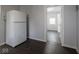 Kitchen featuring white refrigerator and a view to another room at 1327 E Minnesota St, Indianapolis, IN 46203