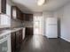 Spacious kitchen featuring dark wood cabinets and light gray walls at 1327 E Minnesota St, Indianapolis, IN 46203