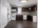 Well lit kitchen featuring wooden cabinets and a white appliance suite at 1327 E Minnesota St, Indianapolis, IN 46203