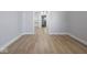 Open-concept living room with wood floors, neutral walls, and an open design, ideal for modern living at 1327 E Minnesota St, Indianapolis, IN 46203