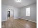 A bright and open living room featuring hardwood floors, neutral paint, and abundant natural light at 1327 E Minnesota St, Indianapolis, IN 46203