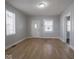 Spacious living area with hardwood floors and neutral wall paint, offering versatility for furniture arrangement at 1327 E Minnesota St, Indianapolis, IN 46203