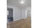 Bright living room featuring wood floors, fresh paint and abundant natural light, creating an airy atmosphere at 1327 E Minnesota St, Indianapolis, IN 46203