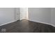 Room featuring grey walls and dark vinyl flooring at 1327 E Minnesota St, Indianapolis, IN 46203