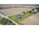 An aerial view highlights the beautiful home set on a large lot with a detached garage, surrounded by farmland at 1502 W 525 N, Lebanon, IN 46052