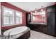 A serene bathroom with a large tub, double vanities, and abundant natural light, providing a spa-like experience at 1502 W 525 N, Lebanon, IN 46052