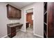 En suite bathroom featuring custom built-in desk and shelving and access to full bathroom at 1502 W 525 N, Lebanon, IN 46052