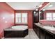The primary bath features a soaking tub, double sinks, and natural light for a luxurious spa-like feel at 1502 W 525 N, Lebanon, IN 46052