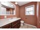 Bathroom featuring dark cabinets, light countertops, and tile floors at 1502 W 525 N, Lebanon, IN 46052