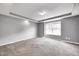 Spacious bedroom with large windows, plush carpeting, and modern gray walls offering comfort and style at 1502 W 525 N, Lebanon, IN 46052