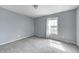 Bedroom featuring a large window and soft carpeting at 1502 W 525 N, Lebanon, IN 46052