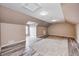 Spacious bonus room with sloped ceilings, wood-look flooring and neutral colored walls at 1502 W 525 N, Lebanon, IN 46052