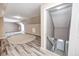 Large bonus room features an open staircase and wood flooring at 1502 W 525 N, Lebanon, IN 46052