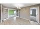 Bright dining area with French doors and updated lighting, offering a seamless transition to other living spaces at 1502 W 525 N, Lebanon, IN 46052