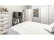 Well-lit bedroom with white wooden dresser and comfortable white bed at 17865 Haralson Row, Westfield, IN 46074