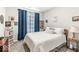 Cozy bedroom featuring blue curtains and a neatly organized shelving unit at 17865 Haralson Row, Westfield, IN 46074