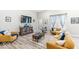 Comfortable living room features modern decor, hardwood floors, and ample natural light at 17865 Haralson Row, Westfield, IN 46074