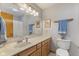 Well-lit bathroom with a vanity, marble countertop, and a neutral color scheme at 1864 Holiday Pines Dr, Brownsburg, IN 46112