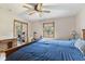 Bedroom with large bed, mirrored closet doors and exercise machines at 1864 Holiday Pines Dr, Brownsburg, IN 46112