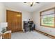 Comfortable bedroom with natural light, closet, and a home office setup at 1864 Holiday Pines Dr, Brownsburg, IN 46112