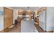 Spacious kitchen with a large center island, stainless steel appliances, and modern cabinets at 1864 Holiday Pines Dr, Brownsburg, IN 46112
