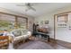 Cozy living area with a floral couch, and large windows providing natural light at 1864 Holiday Pines Dr, Brownsburg, IN 46112