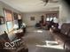 Spacious living room area filled with comfortable furnishings and natural light at 1864 Holiday Pines Dr, Brownsburg, IN 46112