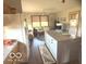 Inviting living room with wood floors and an island with white cabinets at 1864 Holiday Pines Dr, Brownsburg, IN 46112