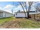 Spacious backyard featuring a garage, grassy lawn, and a privacy fence creating an outdoor retreat at 1924 S A St, Elwood, IN 46036