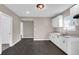 Bright kitchen with stainless steel sink, ample white cabinetry and modern fixtures at 1924 S A St, Elwood, IN 46036