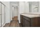Well-lit bathroom features a double sink vanity with hard surface counters and modern fixtures at 1924 White Oak Ln, Shelbyville, IN 46176