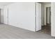 Bright bedroom with carpeted floors and a door leading to the hallway at 1924 White Oak Ln, Shelbyville, IN 46176