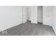 Bright bedroom boasts gray carpeting and crisp white walls, offering versatility and comfort at 1924 White Oak Ln, Shelbyville, IN 46176