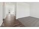 Open-concept space with hardwood floors transitioning to carpeted area at 1924 White Oak Ln, Shelbyville, IN 46176