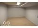 Unfinished basement featuring neutral carpet and white walls at 1936 Cunningham Rd, Indianapolis, IN 46224