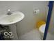 Functional bathroom with a classic pedestal sink and tiled floors at 1936 Cunningham Rd, Indianapolis, IN 46224