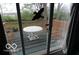 Covered patio with outdoor seating, great for entertaining guests at 1936 Cunningham Rd, Indianapolis, IN 46224